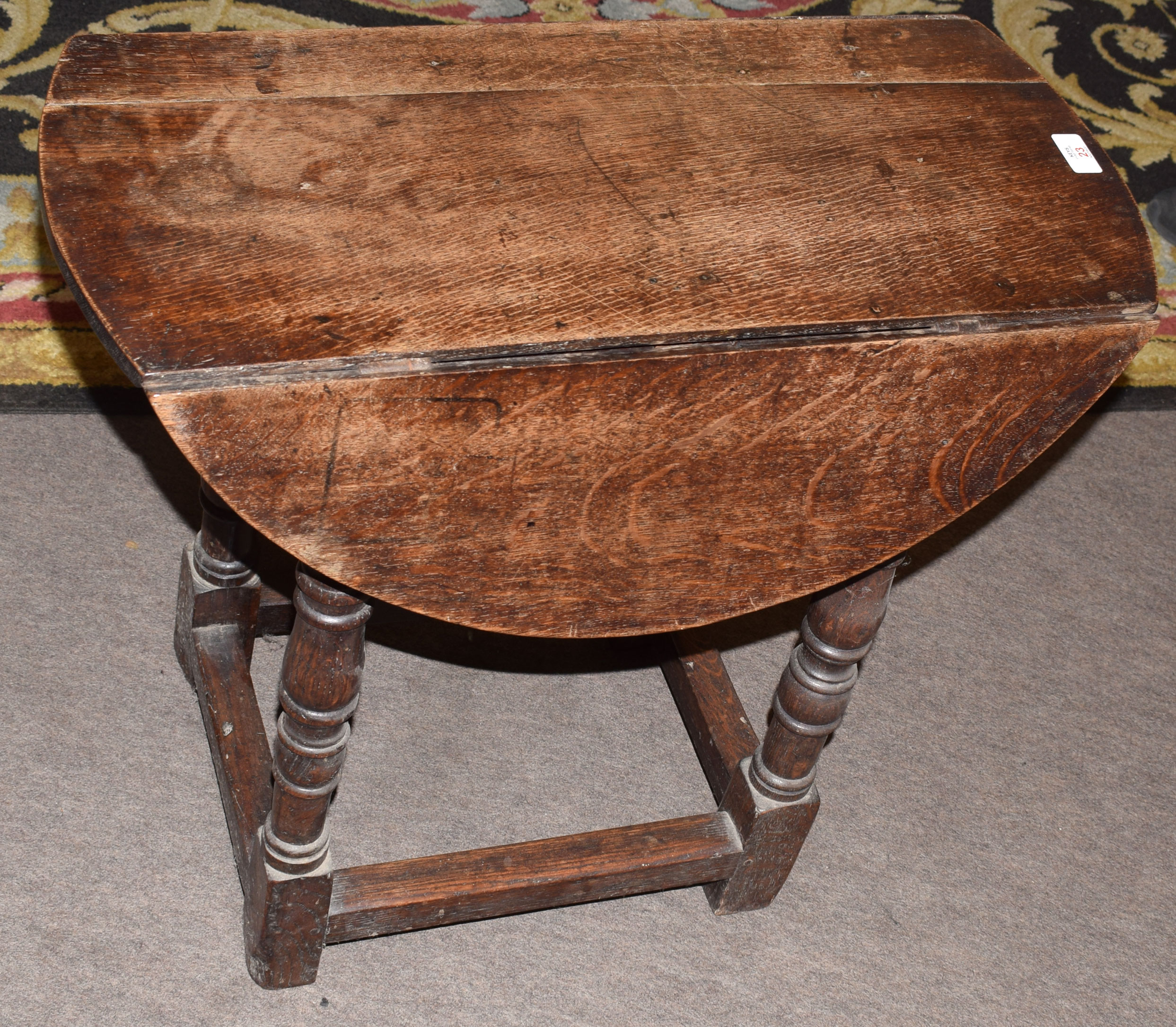 Small 19th century oak drop leaf occasional table on ring turned legs to a stretcher base, the top