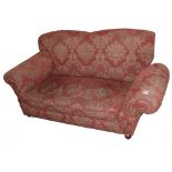 Small reproduction drop-end Chesterfield settee upholstered in red and gold floral material, width