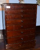 Late 19th/early 20th century stained pine table top collector's chest of seven graduated drawers