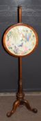 Victorian mahogany adjustable pole screen having a circular silk work panel of exotic bird and