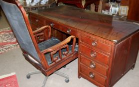 Good quality late 20th century Oriental hardwood twin pedestal desk with plate glass top together