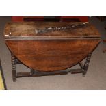 17th/18th century oak gateleg dining table of oval shape supported on bobbin turned and block