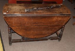 17th/18th century oak gateleg dining table of oval shape supported on bobbin turned and block