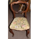 Set of three Victorian rosewood balloon back dining chairs with worn wool work seats (3)