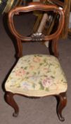 Set of three Victorian rosewood balloon back dining chairs with worn wool work seats (3)