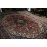 Early/mid-20th century Persian style wool carpet (worn), featuring geometric and floral patterns