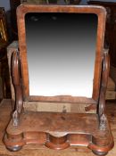 Victorian mahogany swing mirror, having a cushioned rectangular glass to a scrolled frame with