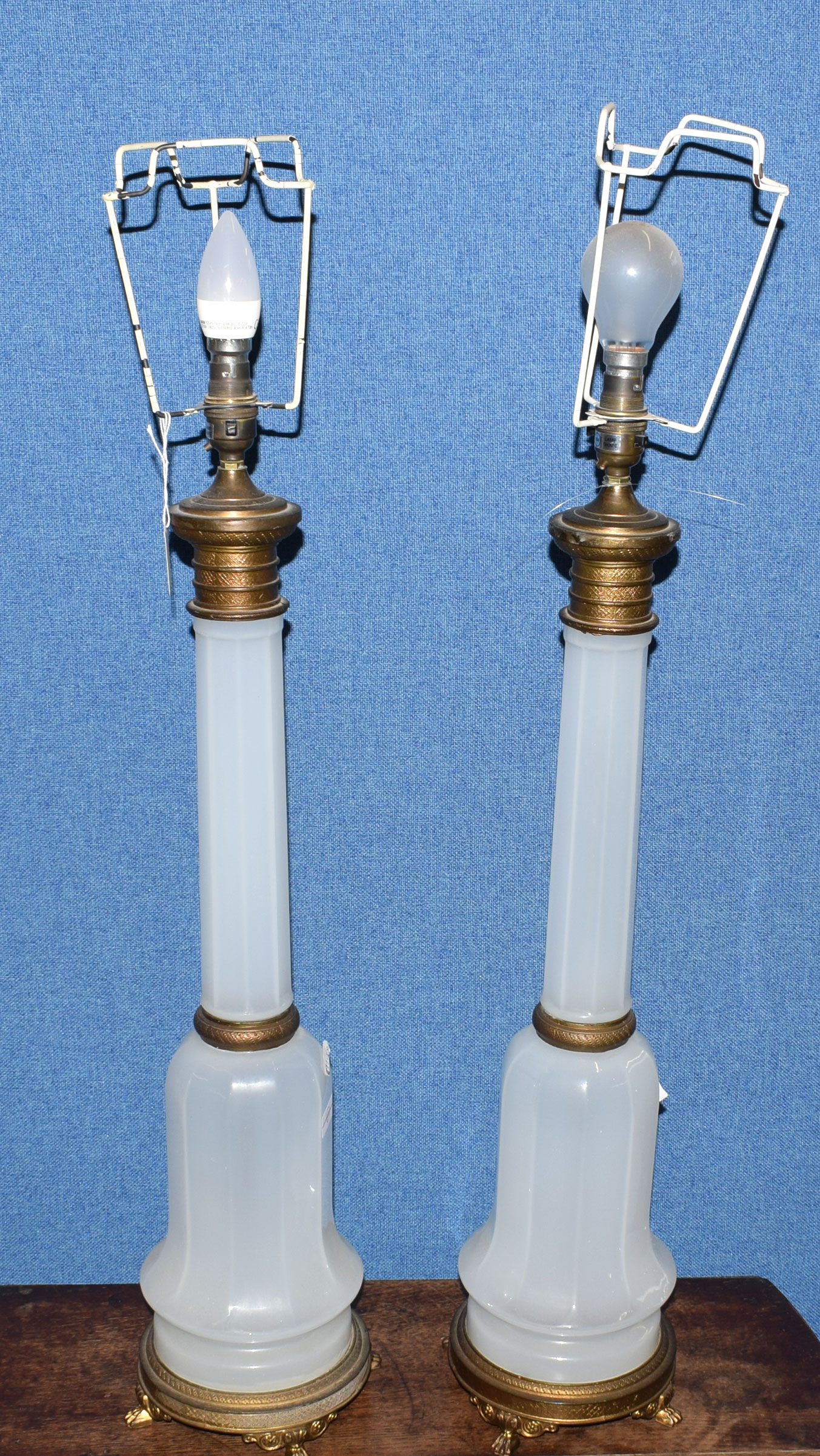 Pair of mid/late 20th century gilt metal and opaque glass table lamps of bell form with faceted