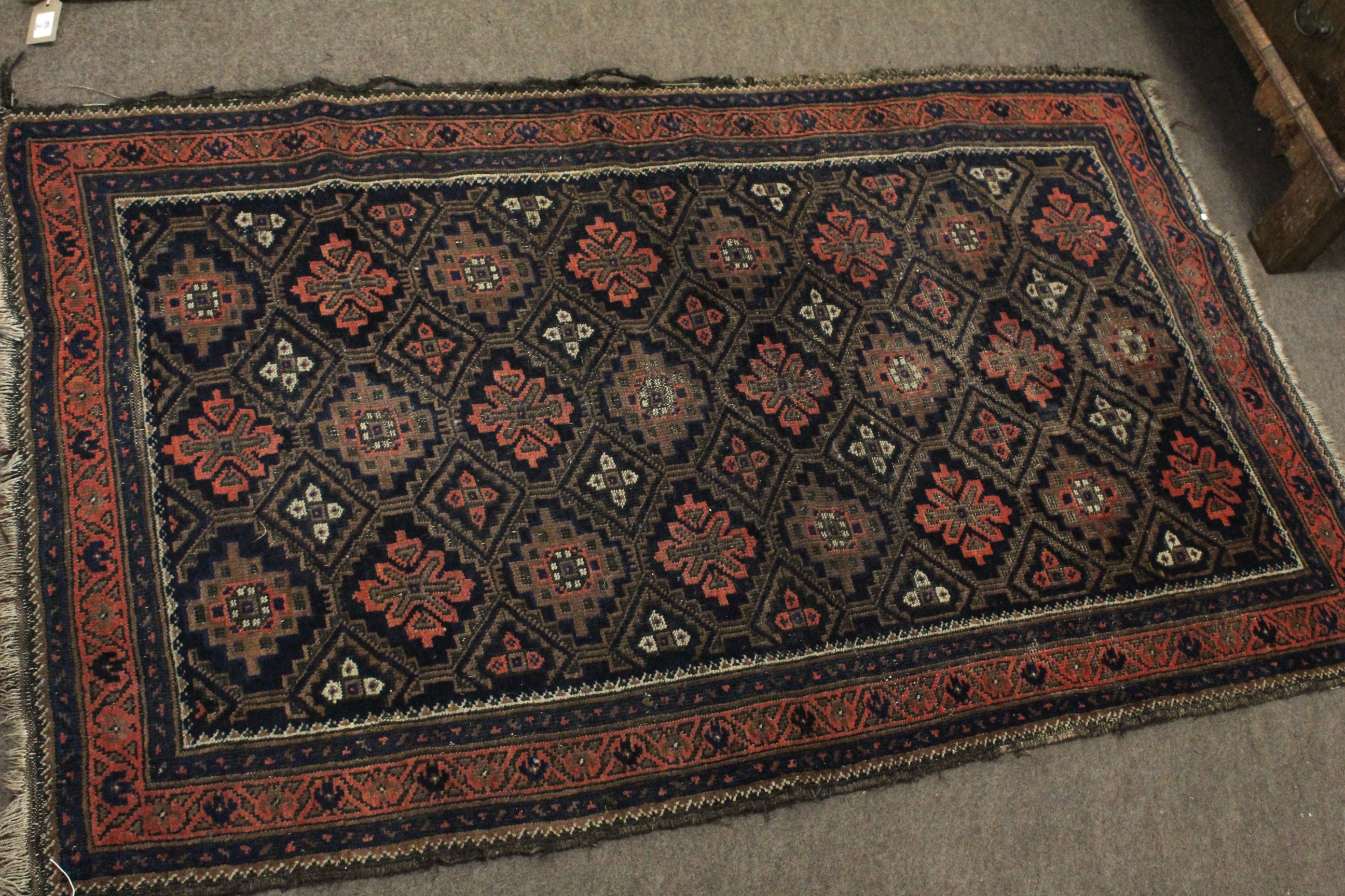 Small Caucasian rug with geometric patterns in rust and blue within five borders, 36cm x 58cm