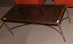 Second or third quarter of 20th century brass framed and smoke glass top coffee table with four