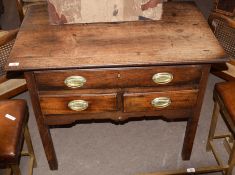 Early 19th century oak lowboy (or side table) of one long and two short drawers to wide frieze,