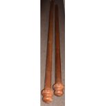 Two large mahogany curtain poles, with turned end finials, 280cm long, the other with one only