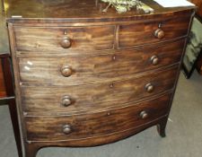 19th century mahogany bow front chest of two and three drawers with turned handles and splayed feet,