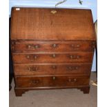 18th century oak bureau, the fall front opening to reveal a pigeonholed interior with six drawers,