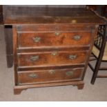 18th century country oak chest of three drawers with brass fittings, panelled sides and bracket