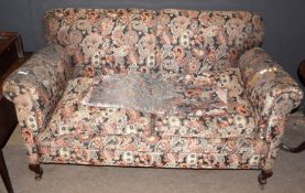 Early 20th century re-upholstered two-seater sofa on short stylised cabriole legs and casters, 157cm