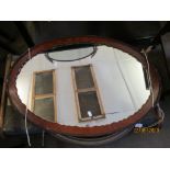 OVAL WALL MIRROR WITH SCALLOPED AND MOULDED MAHOGANY FRAME, LENGTH APPROX 80CM