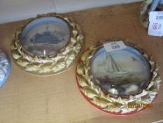 TWO CIRCULAR PRINTS OF SHIPS, ONE A BATTLESHIP, ONE A SAILING SHIP, WITHIN SHELL MOULDED FRAMES,