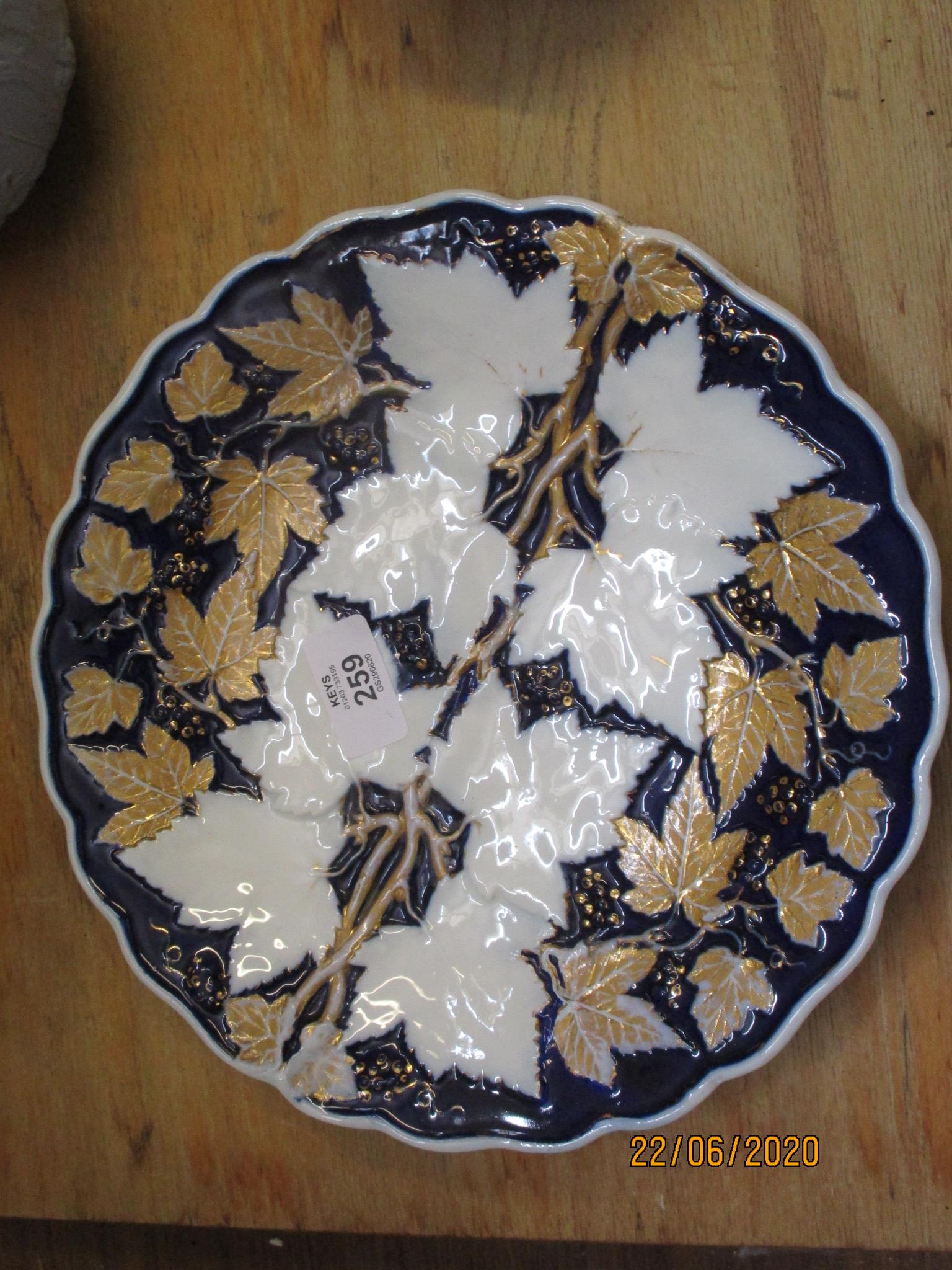 MEISSEN STYLE DISH DECORATED IN UNDERGLAZE BLUE WITH A GILT LEAF DESIGN IN RELIEF, TOGETHER WITH A