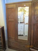 EARLY TO MID-20TH CENTURY CARVED OAK MIRRORED WARDROBE WITH ARTS & CRAFTS STYLE DECORATION, WIDTH