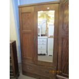 EARLY TO MID-20TH CENTURY CARVED OAK MIRRORED WARDROBE WITH ARTS & CRAFTS STYLE DECORATION, WIDTH