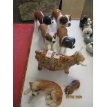 COLLECTION OF DOG AND COW FIGURES