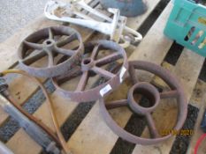 THREE CAST IRON WHEELS