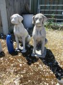 PAIR OF CAST GARDEN FIGURES OF SEATED HOUNDS