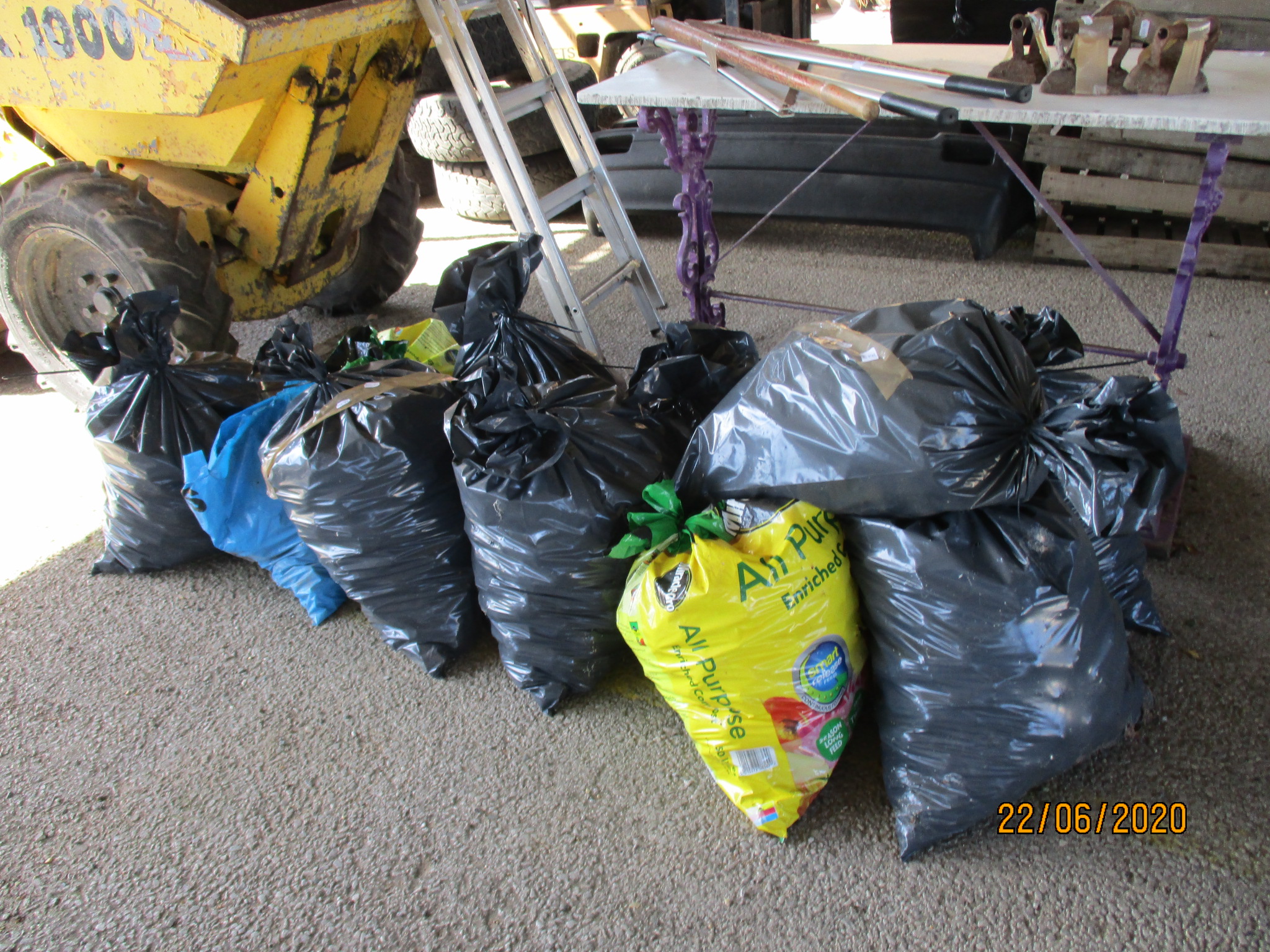 ELEVEN VARIOUS SACKS CONTAINING COAL