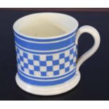English pottery mug with blue chequered design