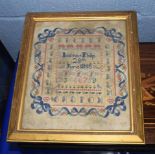 Victorian sampler, wool stitched on gauze, square frame with capital letters, the centre