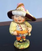 Late 18th century Derby model of a mansion house dwarf, his hat inscribed "Farming Implements by