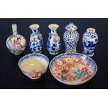 Chinese porcelain tea bowl and saucer decorated with Chinese figures in a landscape, together with a