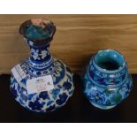 Two Persian Pottery vases with typical floral decoration on blue ground