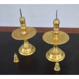 Pair of heavy brass altar candlesticks, each with large central drip trays, together with