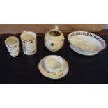 Group of creamwares including tea bowl and saucer, mug with inscription, tea pot (lacking cover) and