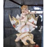 Continental posy vase, with a cherub mounted astride the vase, decorated with floral design (bow