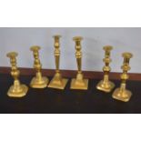 Three pairs of Victorian and later brass candlesticks, largest 26cm high