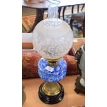 Oil lamp glass patterned shade and blue glass reservoir on brass stand