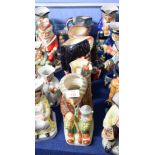 Group of five large Kevin Francis Ceramics jugs including The Golfer, The Piper by Royal Doulton,