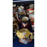 Group of four large Royal Doulton character jugs including The Snake Charmer, The Huntsman, Robin