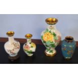 Group of cloisonne vases including large vase decorated with flowers, two smaller vases with similar