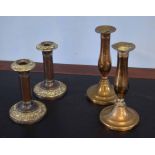 Pair of formerly silver plated on copper candlesticks with embossed sconces and bases and a