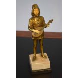 Gilt bronze and compositional bone figure of a standing minstrel with a mandolin wearing period