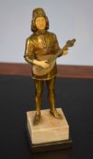 Gilt bronze and compositional bone figure of a standing minstrel with a mandolin wearing period