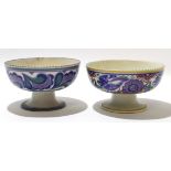 Two Poole Pottery pedestal bowls, one with a bluebird pattern, the other with a comma pattern (2)