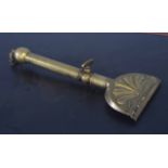 Unusual brass grooming tool, 34cm long