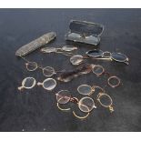 Box containing eight pairs of antique spectacles (some in cases)