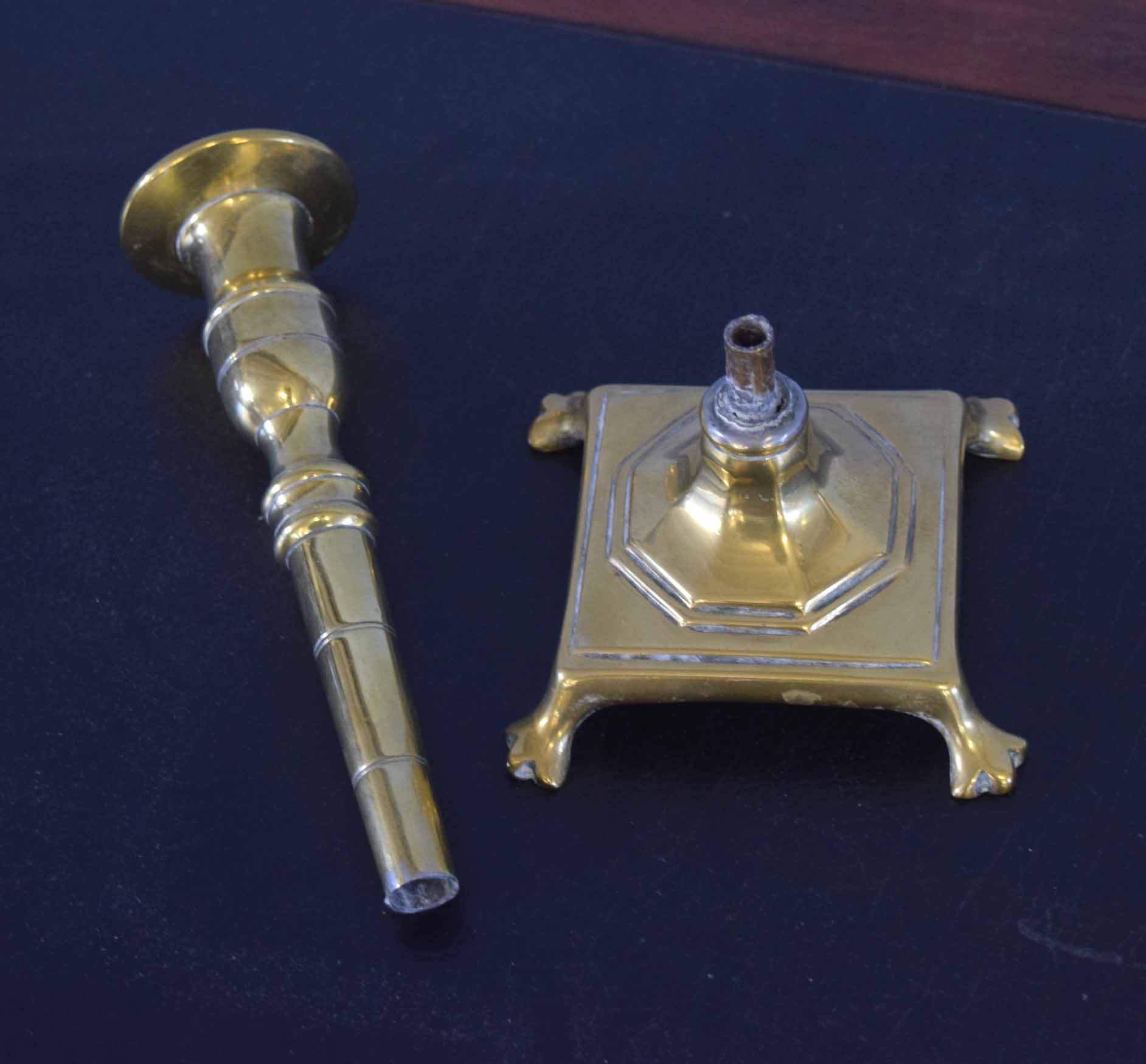 Pair of slender brass candlesticks, the spreading square bases applied with trefid feet, 23cm high - Image 2 of 2