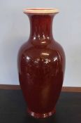 Large Chinese baluster flambe sang de beouf vase with a streaked red and black design, 60cm high